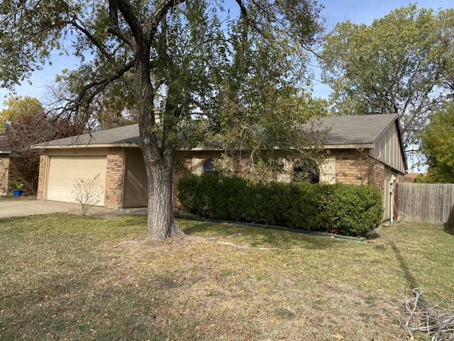 view of front facade featuring a garage and a front lawn