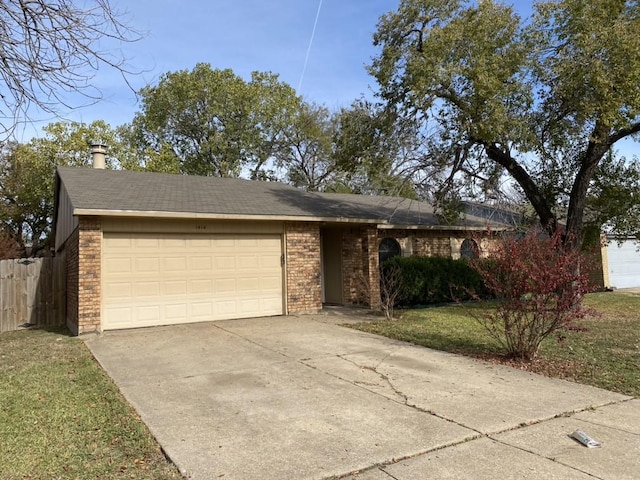 single story home featuring a front yard and a garage