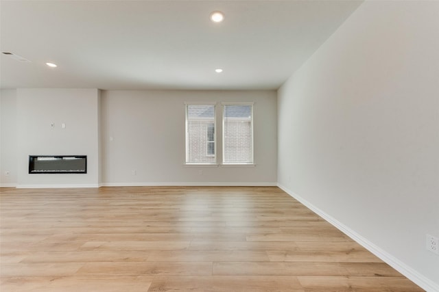 unfurnished living room featuring light hardwood / wood-style flooring