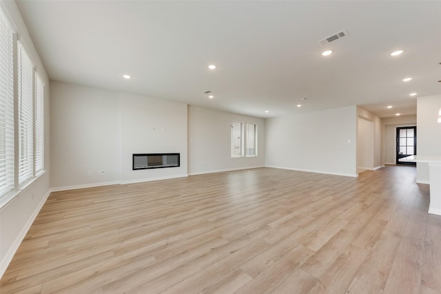 unfurnished living room with light hardwood / wood-style flooring