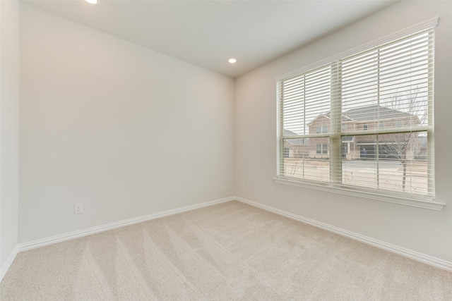 empty room with light colored carpet