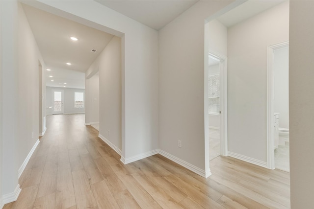 corridor featuring light hardwood / wood-style flooring