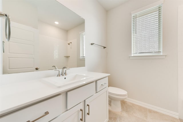 bathroom with tile patterned flooring, vanity, tiled shower, and toilet