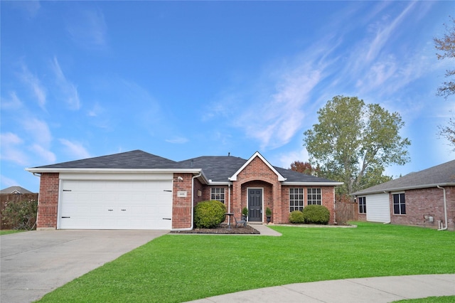 ranch-style home featuring a front yard and a garage