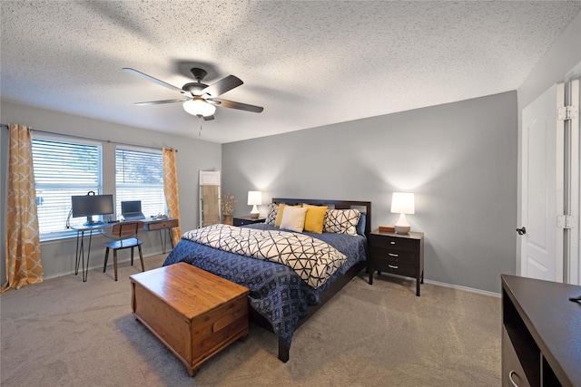 bedroom with carpet, ceiling fan, and a textured ceiling