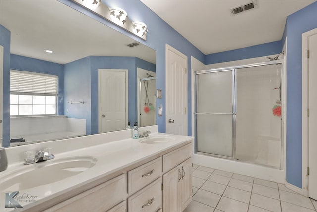 bathroom with vanity, shower with separate bathtub, and tile patterned flooring