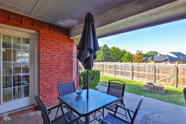 view of patio / terrace featuring an outdoor fire pit