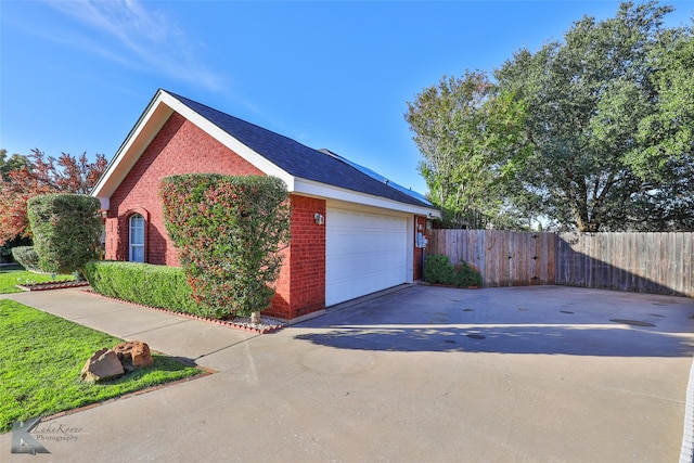 view of side of property with a garage