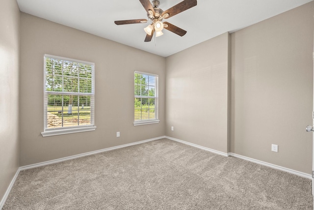 carpeted empty room with ceiling fan