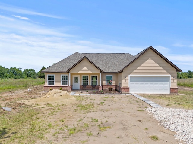 view of front of house with a garage and a porch