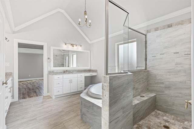 bathroom featuring vanity, vaulted ceiling, hardwood / wood-style flooring, ornamental molding, and a notable chandelier