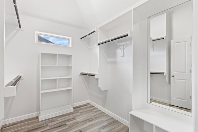 spacious closet with light hardwood / wood-style flooring