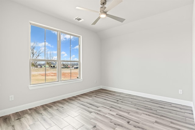 empty room featuring ceiling fan and light hardwood / wood-style flooring