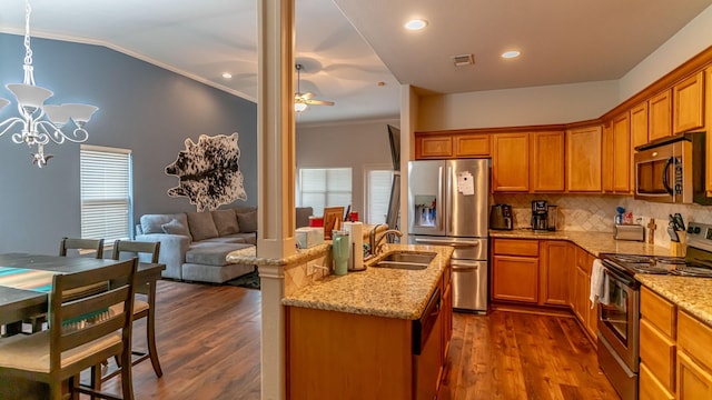 kitchen featuring sink, stainless steel appliances, dark hardwood / wood-style floors, and ornamental molding