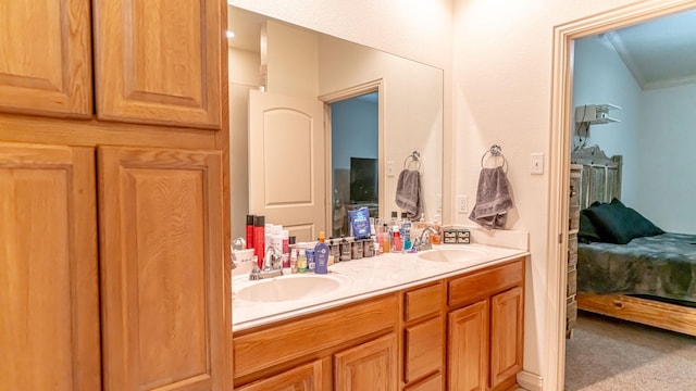 bathroom with vanity and crown molding