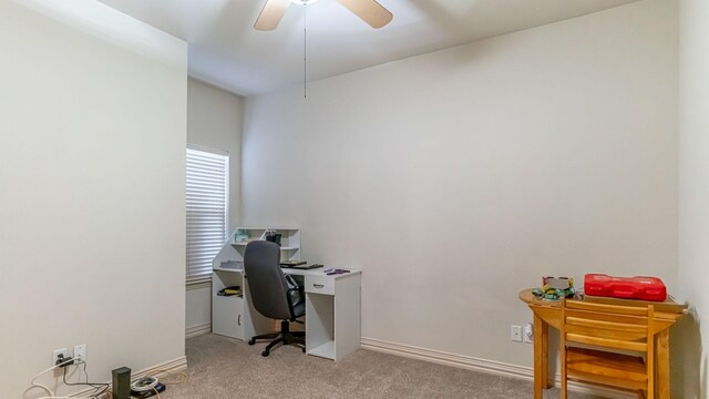 office space with ceiling fan and light colored carpet