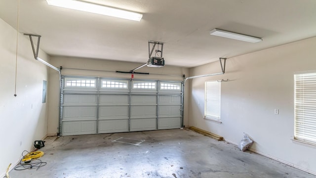 garage featuring a garage door opener and electric panel