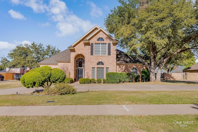 view of property featuring a front yard