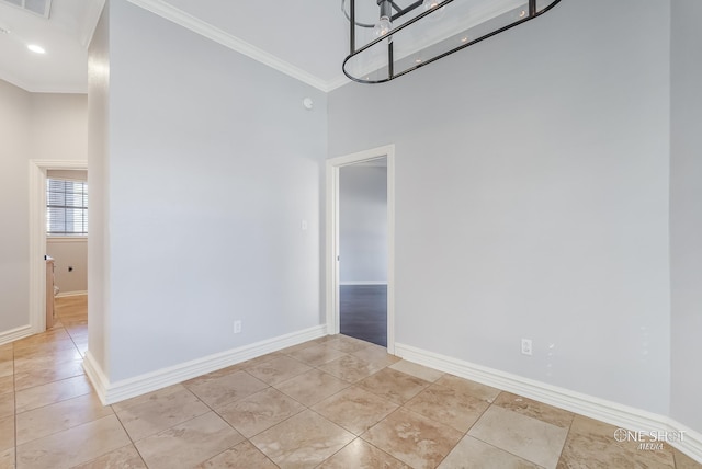 interior space with ornamental molding and light tile patterned floors