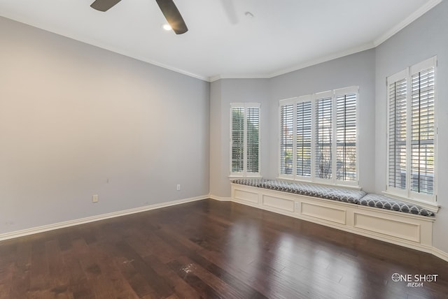 spare room with crown molding, dark hardwood / wood-style floors, and ceiling fan