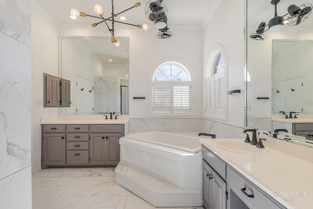 bathroom featuring vanity, separate shower and tub, and ornamental molding