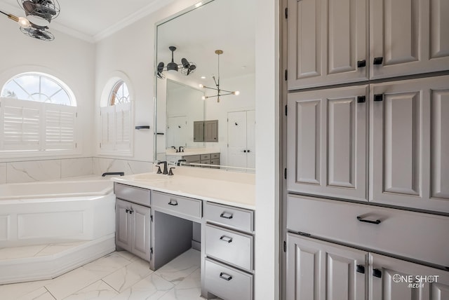 bathroom featuring vanity, a bath, and ornamental molding