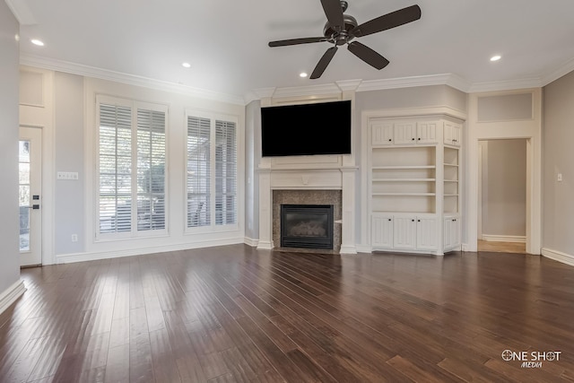 unfurnished living room featuring crown molding, ceiling fan, and dark wood-type flooring