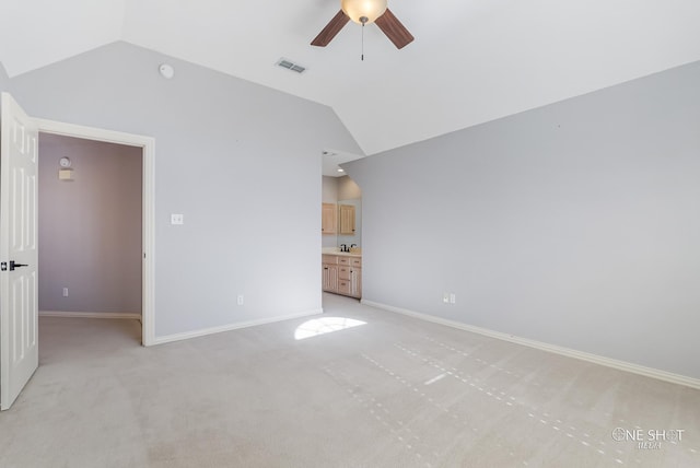 interior space featuring ceiling fan and vaulted ceiling