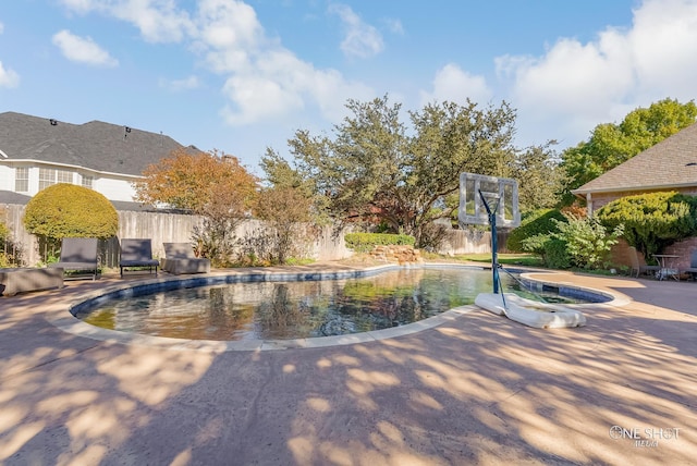 view of pool featuring a patio area