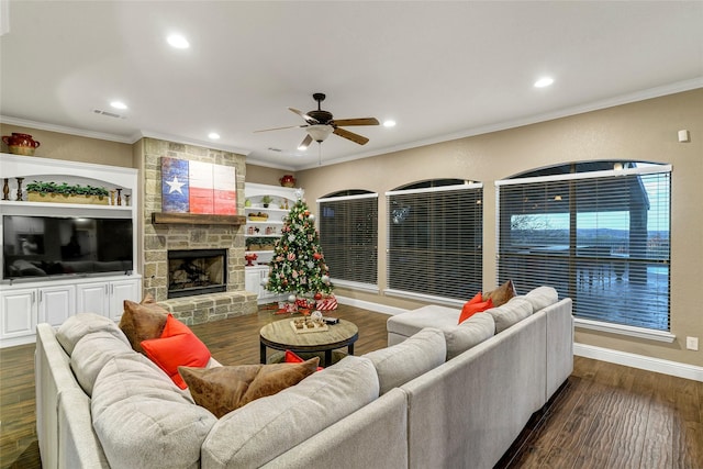 living room featuring a fireplace, ornamental molding, and dark hardwood / wood-style floors