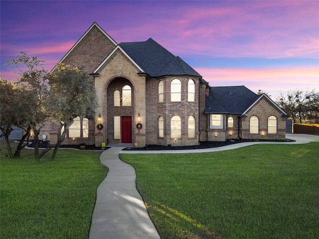 french country home with a yard