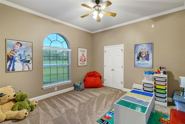 game room with ornamental molding, ceiling fan, and carpet flooring