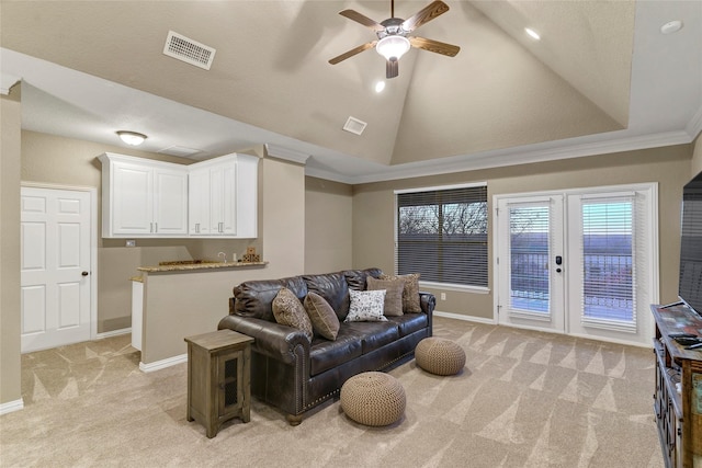 carpeted living room featuring crown molding, ceiling fan, high vaulted ceiling, and french doors