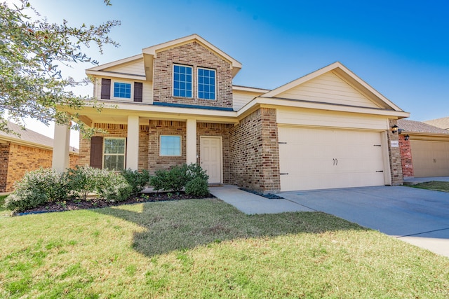 view of front of property featuring a garage and a front yard