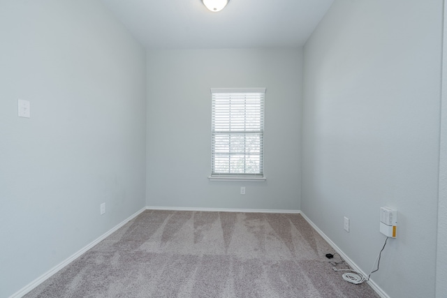 unfurnished room with light colored carpet