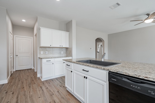 kitchen featuring dishwasher, sink, light hardwood / wood-style flooring, backsplash, and white cabinets