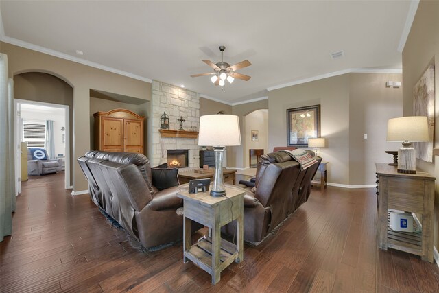 living room featuring a fireplace, crown molding, and dark hardwood / wood-style flooring