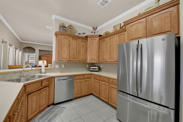 kitchen featuring decorative backsplash, ornamental molding, stainless steel appliances, sink, and light tile patterned flooring