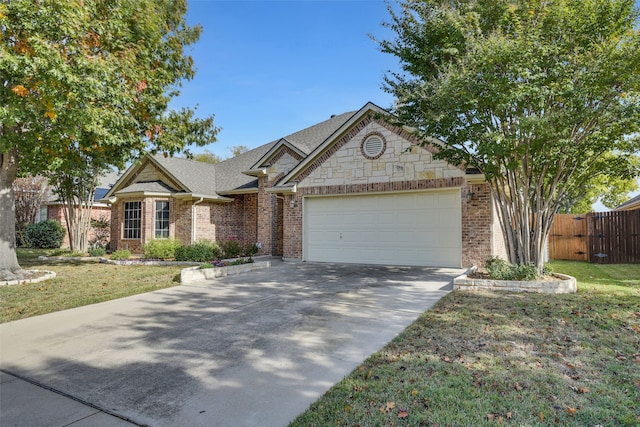 view of front of house featuring a garage and a front yard