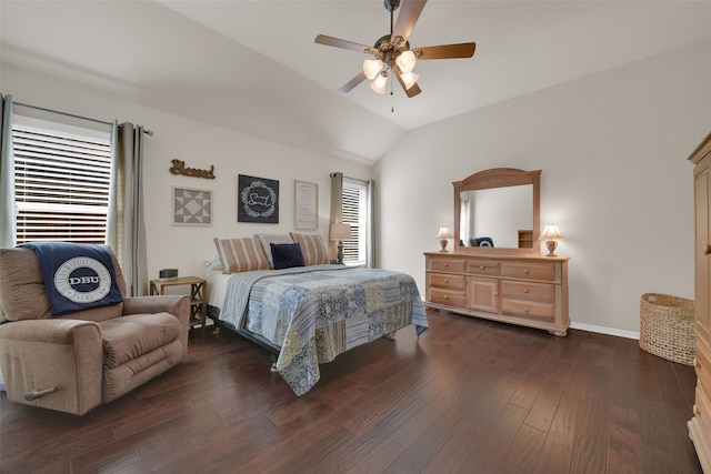 bedroom featuring dark hardwood / wood-style floors, multiple windows, lofted ceiling, and ceiling fan