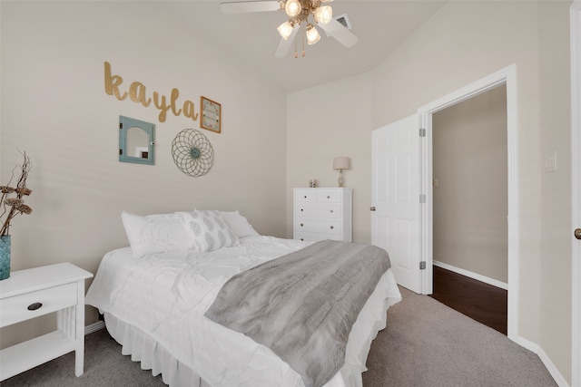 bedroom featuring dark carpet and ceiling fan