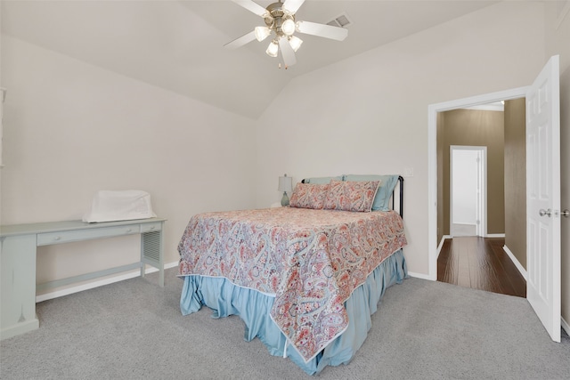 bedroom featuring hardwood / wood-style flooring, ceiling fan, and vaulted ceiling