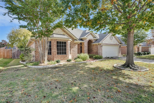 view of front of house featuring a front lawn and a garage