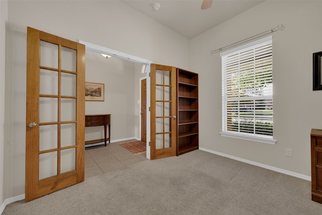 interior space featuring light carpet and french doors