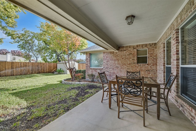 view of patio / terrace featuring a shed