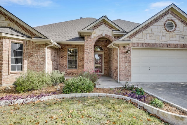 view of front of home with a garage