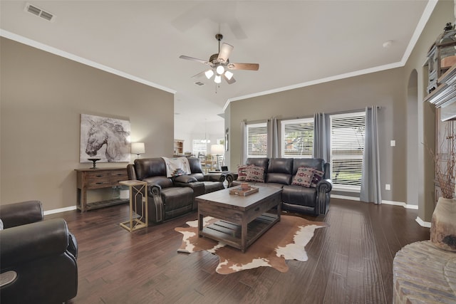 living room with dark hardwood / wood-style floors, ceiling fan, and crown molding