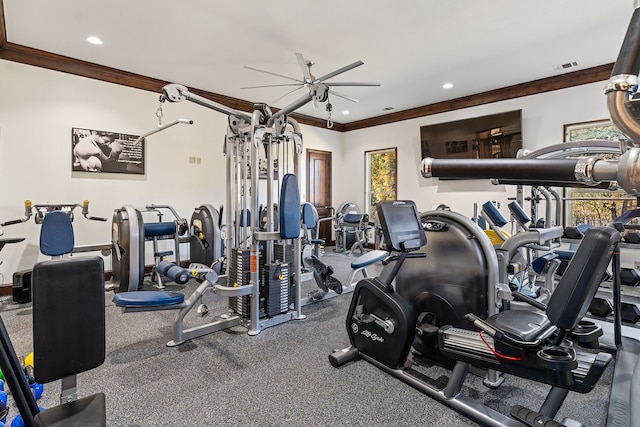 workout area featuring ceiling fan and ornamental molding