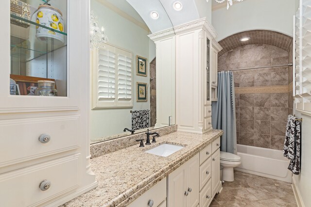 full bathroom featuring shower / tub combo, tile patterned floors, vanity, vaulted ceiling, and toilet