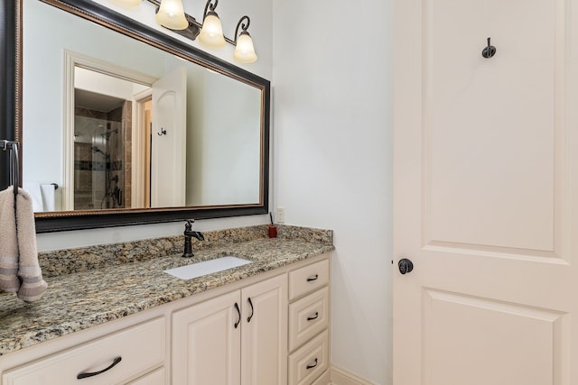 bathroom featuring vanity and a shower with shower door